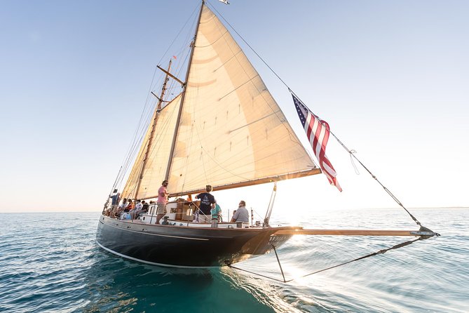 Sailing on Historic Schooner Yacht in Salem, MA - Hoisting the sails with the crew: Kos, Kate, and Captain Seth
